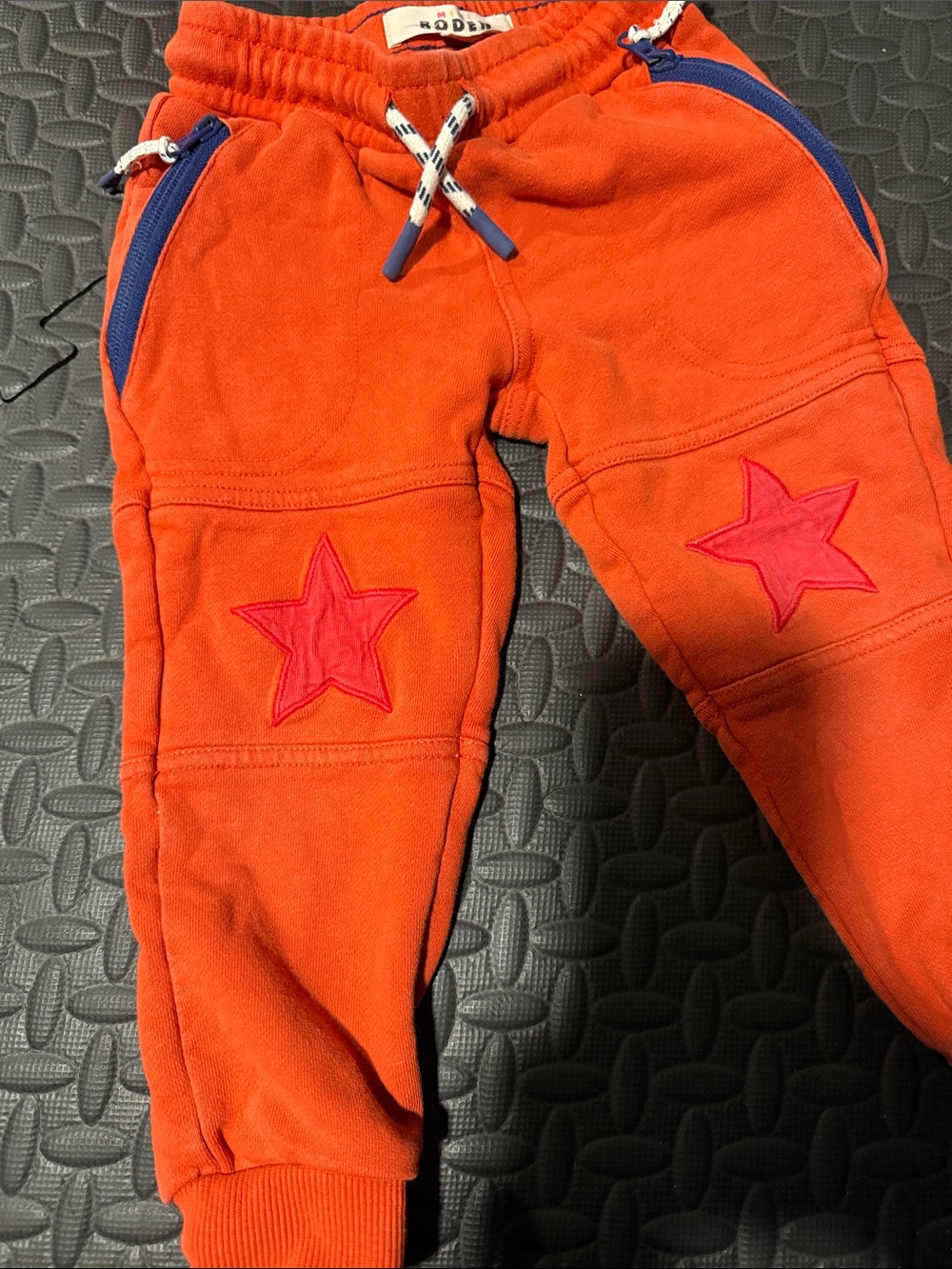 Mini Boden Bright Orange Joggers with Pink Star Knee Patches